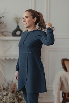 Whether you would like to refer to it as a knee length scrub top with a skirt-like bottom or a dainty scrub dress, we can assure you that Rose is the epitome of practicality like you’ve never seen it before. Inspired by our iconic bestselling Orchid top that you all know and love; Rose is designed with a flap on the torso for free, unrestricted, full range of movement and easy access to pant pockets. The top features a discreet, matching zipper at the top and two hidden pockets on the sides for Scrub Dress, Rose Scrub, Scrub Suit, Stylish Winter Coats, Scrubs Dress, Dental Life