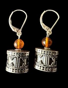 Exquisite Bali beads paired with amber, dangling elegantly from lever back earrings measuring 1/2 inch in length. Amber Dangle Earrings With Lever Back Ear Wires, Amber Dangle Earrings With Lever Back, Henderson Nv, Jewelry Earrings Dangle, Bali, Dangle Drop Earrings, Amber, Dangle Earrings, Jewelry Earrings