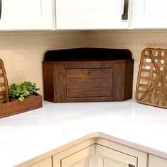 kitchen counter with white cabinets and wooden utensils