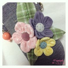 a close up of a purse with flowers on it