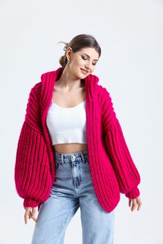 Stay cozy in style this season with our must-have chunky cardigan! Made with premium hand-knit wool and featuring on-trend balloon sleeves, this oversize cardigan is the perfect addition to your fall wardrobe. Whether you're dressing it up or down, it's versatile enough to be worn with anything from jeans to dresses. The open front design and hoodie add extra comfort and warmth on chilly days. And best of all, it's lovingly handcrafted with the utmost care and attention to detail. It's also a perfect Mother's Day gift for your mom, who will appreciate the handmade craftsmanship and thoughtful design. Crochet Knit Cardigan Size Guide : Country/Size ... S/M  M/L  L/XL USA & CAN : .... 2 - 6  6 - 10  10 - 14 EU :  34-38 .... 38-42  42-46 UK & AUS :  6-10  10-14  14-18 Made of highest quality Trendy Winter Hand Knitted Outerwear, Trendy Hand Knitted Winter Outerwear, Trendy Hand Knitted Outerwear For Winter, Trendy Hand Knitted Outerwear For Fall, Oversized Knitted Outerwear, Fall Hand Knitted Outerwear, Trendy Knitted Sweater Coat For Winter, Cozy Long Sleeve Acrylic Yarn Outerwear, Cozy Hand Knitted Fall Sweater Coat