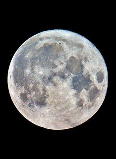 the full moon is seen in the sky with no clouds on it's side