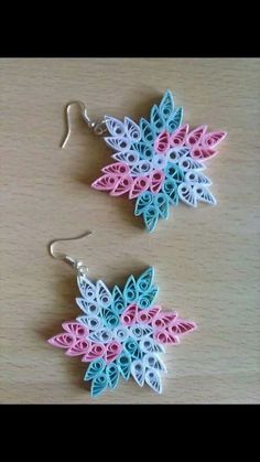 two pairs of earrings made out of paper