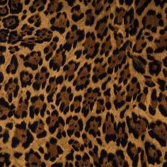 an animal print fabric with brown and black spots on it's fur, showing the pattern