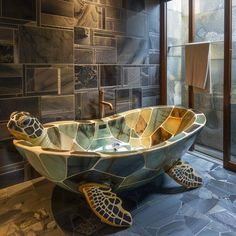 a bathroom with a turtle shaped bathtub in the middle and tile on the walls