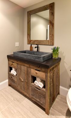 a bathroom with a sink and mirror in it