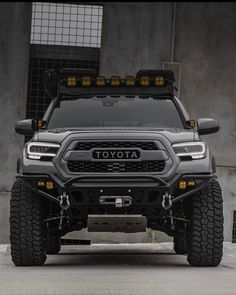 the front end of a gray toyota truck