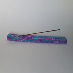 a pair of chopsticks sitting next to each other on a white table top