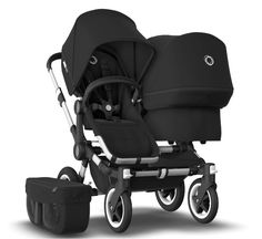 the buggy stroller is black and has two seats