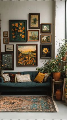 a living room filled with lots of pictures and plants on the wall next to a couch