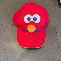 New Without Tags Elmo Youth Snapback/Baseball Cap. 100% Cotton. Adjustable. Embroidered Face With Puff Nose. Elmo Embroidered In Blue On Back Of Hat. In Excellent Condition Since It Is New. Elmo Beanie, Orange Curved Brim Baseball Cap For Streetwear, Novelty Red Baseball Cap One Size, Adjustable Orange Snapback Hat, Novelty Red Baseball Cap, Street Accessories, Snapback Cap, Sesame Street, Kids Accessories