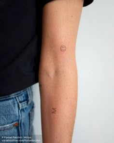 a person with a small tattoo on their arm