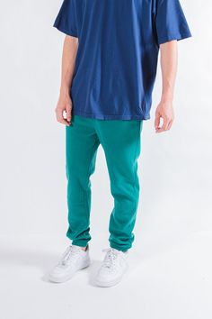 Do you need to level up your sweatpants game? If so the Forest Green 2.0 Sweatpants are perfect for you. These are great because the bright color really pops but the solid fleece material provide a great base for any outfit. The 2.0 Sweatpants are unbelievably comfortable, you won't ever want to rock anything else. Pick out a nice tee and your favorite pair of kicks and you are ready to chill. The poly fleece material is what makes it soft to the touch as well as durable. Sizes range from small Streetwear Fleece Sweatpants With Elastic Waistband, Relaxed Fit Fleece Sweatpants For Streetwear, Solid Color Athleisure Joggers For Streetwear, Athleisure Sweatpants With Ribbed Waistband For Streetwear, Green Jogging Pants With Elastic Waistband, Green Tapered Leg Sweatpants With Elastic Waistband, Athleisure Fleece Pants For Streetwear, Sporty Solid Color Joggers For Streetwear, Solid Sporty Joggers For Streetwear