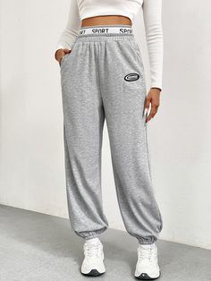 F00215614-102 Baggy Solid Color Sports Pants, Gray Relaxed Fit Sports Bottoms, Gray Relaxed Fit Bottoms For Sports, Sweatpants With Side Pockets For Gym, Solid Color Sweatpants With Side Pockets For Gym, Sportswear Sweatpants With Letter Print For Jogging, Gray Baggy Sports Pants, Sportswear Sweatpants With Pockets For Sports, Gray Joggers With Side Pockets For Workout