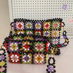 the beaded purse is decorated with flowers