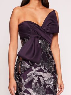 The Lotus Sequin Midi Dress is constructed with duchess satin and adorned with lotus sequin work. The pencil cocktail dress features a diagonal bow twist detail on the bodice and slit at the back of the skirt. Plum Dresses, Plum Dress, Gown Skirt, Duchess Satin, Sequin Midi Dress, Deep Plum, The Pencil, The Lotus, Marchesa