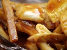 a pile of french fries sitting on top of a table