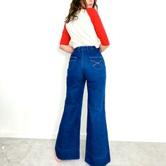 Vintage Wrangler Wide Leg Bell Bottoms Circa 1970's, Made In Usa "Sanfor-Set" Deep Indigo Wash Orange Stitching, X Stitching On Pockets 100% Cotton Zip Closure With Snap Button Ultra High Rise, Roomy At Hips And Bum, Wide Leg To Hem Handful Of Small Holes On Right Leg, 3 In Front, 3 In Back Subtle Fade Lines From Previous Hem Best Fit Size 30 Waist Flat 15” Hips Flat 21.5” Rise 13” Inseam 35” Please View All Details Before Purchasing, All Items Sold As Is. Buyer Is Responsible For Viewing All Photos And Reading Descriptions Before Purchase. Reasonable Offers Always Welcome! Check Out My Closet For Other Great Pieces @Theconservatory Deep Indigo, Vintage Wrangler, Bell Bottoms, Snap Button, Flare Jeans, Theater, Made In Usa, No Response, Wide Leg