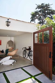 an open garage door with a bicycle parked in it