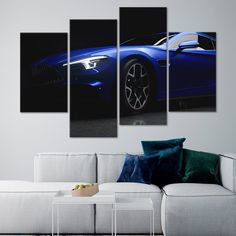 a blue sports car in the dark on a black background multi panel canvas wall art