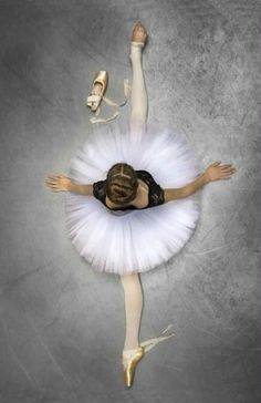 a ballerina in white tutu and ballet shoes with her arms stretched out to the side