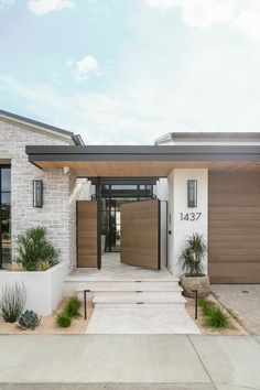 the front entrance to a modern home