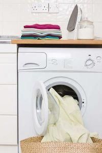 a washer and dryer sitting next to each other in a kitchen