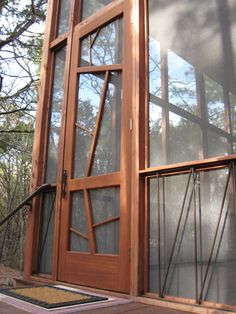 a wooden door with glass panels on the outside