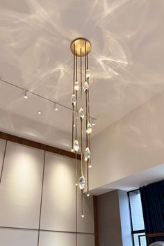 a chandelier hanging from the ceiling in a room