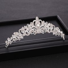 a tiara is shown on display in a black box