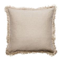 a beige pillow with fray edges