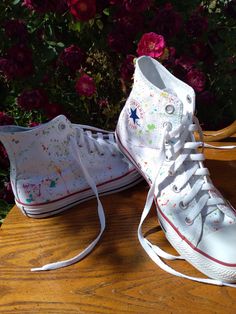 White Converse Shoes painted with some fun splashes of color then sealed with a professional shoe protectant.  The shoe sizes will only appear in men's but I will also do women sizes, let me know which one you want when ordering.I will take requests for the paint colors !! Painted Converse High Tops, Shoes Painting, White Converse Shoes, Painted Converse, Professional Shoes, White Converse, Painted Shoes, Converse High, Paint Splatter