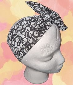 Add a touch of edgy style to your look with this striking Skull Print Headband! This adjustable dolly-style wire head wrap combines fashion with function, offering a bold and playful accessory that's perfect for everyday wear or special occasions. Crafted with a flexible wire, this headband allows you to easily adjust it for a customized fit--whether you want to tie it into a bow, twist it, or wrap it around your head for a unique look every time. The skull print adds a fun gothic vibe, making it perfect for those who love alternative, rock, or Halloween-inspired fashion. Whether you're dressing up for a spooky event, adding flair to your casual outfit, or looking for a standout accessory for festivals, this skull print headband is a versatile must-have for your wardrobe! ✨ Features:     B Dolly Style, Edgy Style, Alternative Rock, Inspired Fashion, Turbans, Skull Print, Head Wrap, Edgy Fashion, Head Wraps