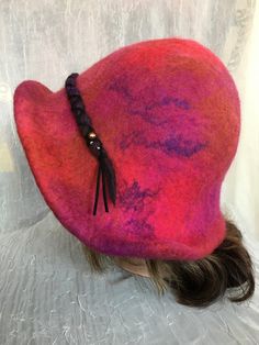 Love how this hat came out ! Red wet Felted flapper hat Ooak . Decorated with wet Felted flower. Beaded . Mannequin head size is 21 , will fit up to 23.5 created as one of a kind. Brim can be pulled o we the ears . Feel free to email me any questions. Thanks. Red Wool Felt Hat For Winter, Red Wool Brimmed Hat, Red Short Brim Cloche Hat For Fall, Red Winter Cloche Hat, Red Wool Hat With Short Brim, Red Cloche Hat With Curved Brim For Winter, Red Winter Cloche Hat With Curved Brim, Handmade Winter Cloche Hat, Red Cloche Hat For Winter