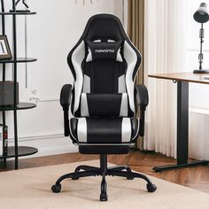 a black and white office chair sitting on top of a rug