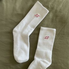 "Details: - Embroidered - 80% cotton, 17% polyester, 3% spandex - Cushioned sole - Machine washable - Made in USA Introducing the Carlos Sainz Embroidered \"55\" Ankle Crew Sock- the perfect subtle expression of your love for all things Carlos x Ferrari x Formula 1." Comfortable Stretch White Socks, Comfortable Sports Socks For Spring, White Super Soft Socks, White Super Soft Comfortable Socks, Comfortable Super Soft White Socks, White Stretch Cotton Socks, White Sports Socks For Winter, White Sporty Winter Socks, White Sporty Socks For Winter