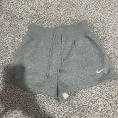 Women's High-Waisted Loose Shorts Heather Gray Size Small Never Worn Nike Workout Bottoms With Ribbed Waistband, Nike Shorts For Jogging, Comfortable Nike Workout Bottoms, Nike Workout Bottoms, Casual Athletic Shorts For Spring Jogging, Grey Nike Pros, Black Spandex Shorts, Nike Sportswear Phoenix Fleece, Nike Shorts Women