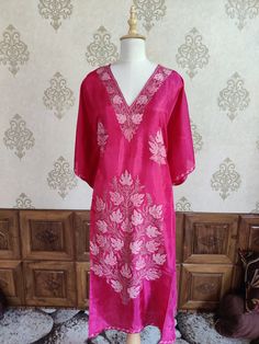 Step into the spotlight with our Fuchsia Fantasy Aari Embroidered Kaftan. The vibrant fuchsia pink canvas is beautifully embellished with intricate light pink Aari embroidery, creating a stunning contrast. The elaborate floral design on the neckline and the cascading motifs down the front add a touch of glamour and sophistication. Perfect for festive occasions and special events, this Kaftan combines cultural heritage with contemporary style. The luxurious fabric ensures a comfortable fit, while the detailed embroidery showcases the exquisite craftsmanship of Kashmiri artisans. Elevate your style with this captivating piece that embodies elegance and tradition. Embroidered Rug, Embroidered Kaftan, Aari Embroidery, Silk Carpet, Pink Canvas, Pashmina Shawl, Pashmina Scarf, Embroidered Jacket, Fuchsia Pink