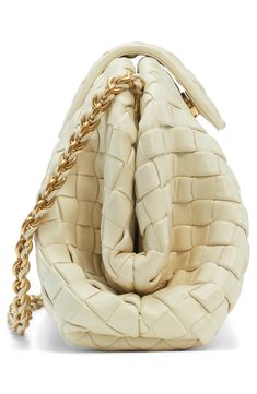 A reimagined version of a 1980 archival design from Bottega Veneta, this clutch is made of supple lambskin leather using their signature intrecciato technique. A drop-in leather-woven chain strap offers an additional carrying option. Magnetic tab closure Drop-in chain-and-leather strap Leather lining Leather Made in Italy Designer Handbags Designer Woven Leather Clutch, Luxury Cream Leather Clutch, Luxury Clutch With Intrecciato Weave, Luxury Cream Shoulder Bag With Woven Leather, Luxury Cream Woven Leather Shoulder Bag, Luxury Cream Shoulder Bag With Intrecciato Weave, Luxury Cream Intrecciato Shoulder Bag, Luxury Evening Clutch With Intrecciato Weave, Woven Chain