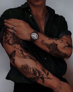 a man with many tattoos on his arms