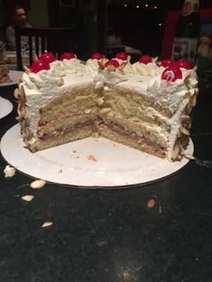 there is a very large piece of cake on the table with it's slice taken out