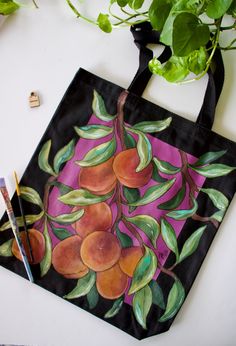 "~Hand painted reusable canvas tote bag with an original peach tree handpainted design on front!  ~This tote has a pocket for small items such as phones, keys, etc ~This is a perfect bag to take to the book store, beach, grocery shopping, or every day use ~Eco friendly and stylish way to carry items ~Hand crafted with care, painted with acrylic paint mixed w/ fabric medium ~Care: Due to the nature of the item it is spot clean, or hand wash only. Please do NOT machine wash bag.  ~Colors may vary Handpainted Totebag, Handpainted Tote, Handpainted Tote Bags, Hand Painted Purses, Fabric Painting Techniques, Peach Tree, Cool Paper Crafts, Painted Tote, Free Hand Rangoli