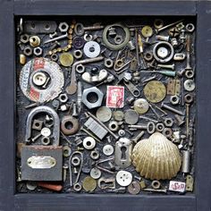 an assortment of assorted metal objects in a shadow box