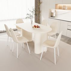 a white dining table with four chairs around it and a bowl of fruit on the table