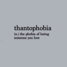 the words thantopphobia in black and white on a gray background with an image of a