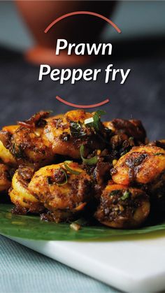 a close up of a plate of food with the words prawn pepper fry