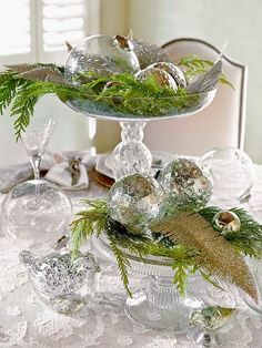 two tiered trays filled with ornaments on top of a table