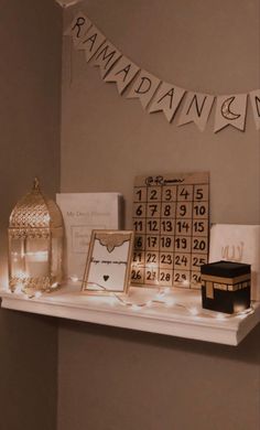 a shelf with cards, pictures and lights on it