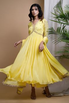 Bright yellow anarkali with moti, zardosi, zari hand embroidery on front yoke and sleeves. Paired with a straight palazzo and a dupatta with hand embroidered lace and moti border. - Aza Fashions Semi-stitched Anarkali V-neck Dress, V-neck Anarkali Set For Eid Party, Anarkali Set With V-neck And Dupatta, Designer Anarkali Dress With V-neck, Diwali Anarkali V-neck Dress, Fitted V-neck Anarkali Set For Navratri, Bollywood Style Fitted V-neck Anarkali Set, Fitted V-neck Anarkali Set For Festivals, Festive V-neck Salwar Kameez For Wedding