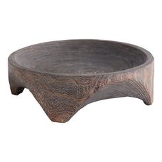 a wooden bowl sitting on top of a table